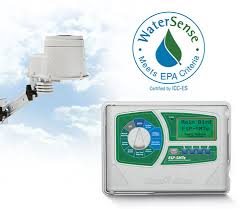 An outdoor device part and an electronic control panel, set against a light blue sky with soft clouds. Above the control panel, there is a logo with the text "WaterSense Meets EPA Criteria" encircling a droplet-shaped graphic that is half green and half blue, indicating certification by ICC-ES.